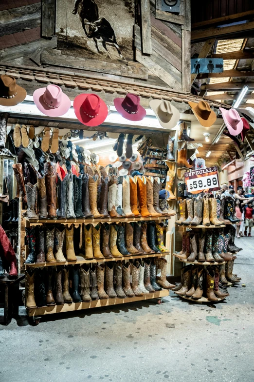 a store filled with lots of boots and hats, downtown mexico, lots of signs and shops, fan favorite, touring