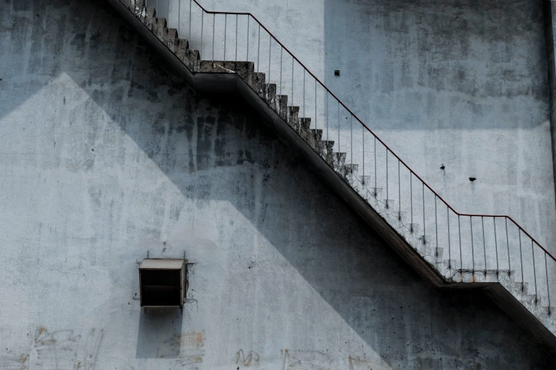 a red fire hydrant sitting in front of a building, an album cover, unsplash contest winner, postminimalism, stairway, blue gray, alessio albi, brutalist