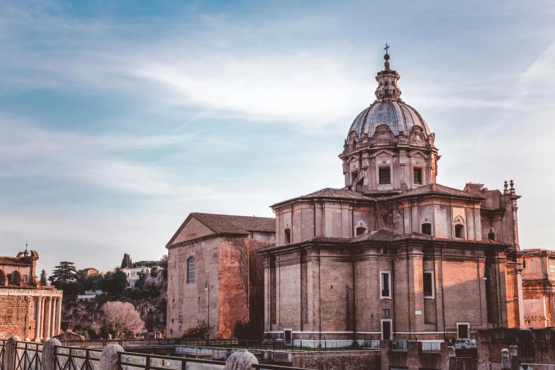 a large building with a dome on top of it, by Cagnaccio di San Pietro, pexels contest winner, neoclassicism, evening light, parce sepulto, valle dei templi, profile picture 1024px