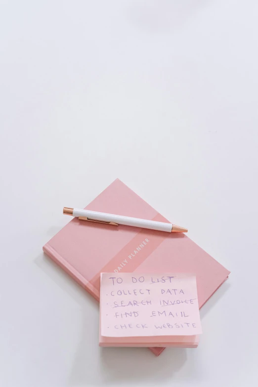 a notepad with a pen sitting on top of it, by Nicolette Macnamara, light pink, 8 k -