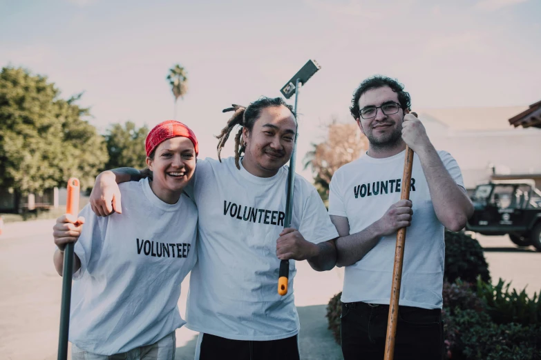 a group of people standing next to each other, a portrait, unsplash, holding a staff, gardening, avatar image, california;