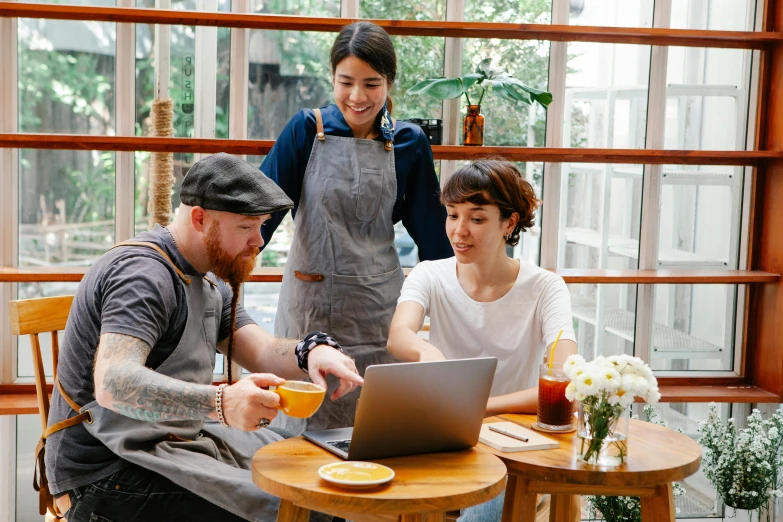 a couple of people sitting at a table with a laptop, aussie baristas, avatar image, maintenance photo, thumbnail