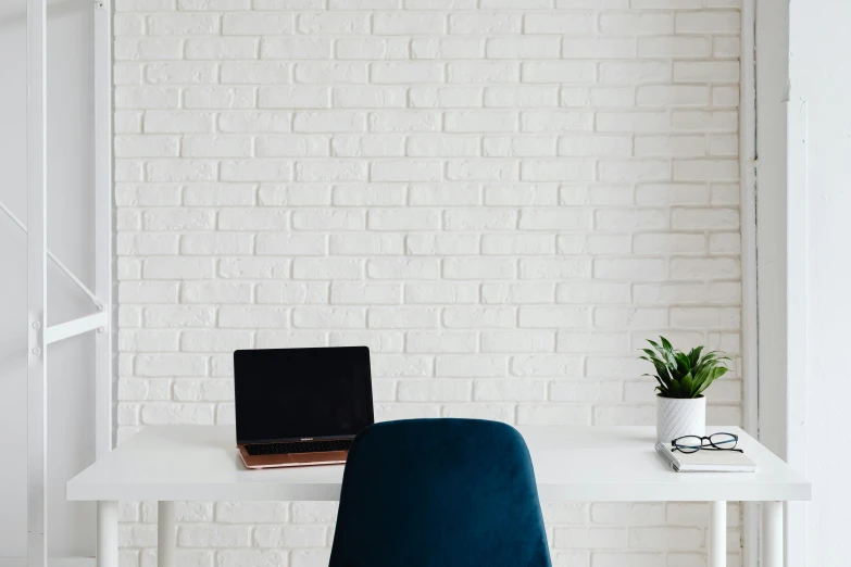 a laptop computer sitting on top of a white desk, pexels contest winner, postminimalism, decoration, background image, no text, white wall coloured workshop