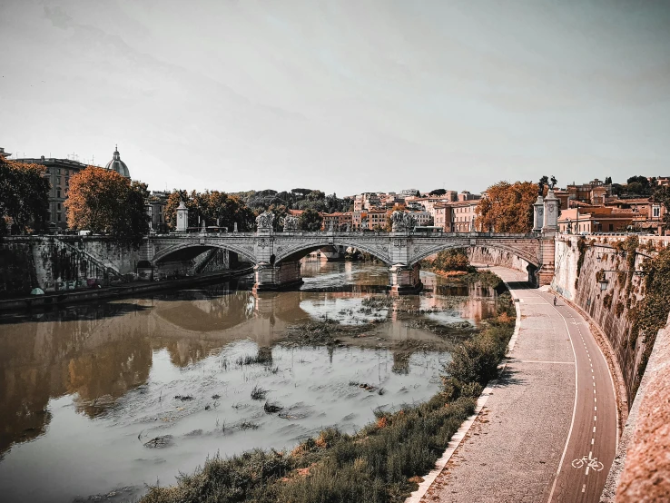 a view of a bridge over a body of water, by Cagnaccio di San Pietro, pexels contest winner, neoclassicism, datapipeline or river, with instagram filters, profile image, high view