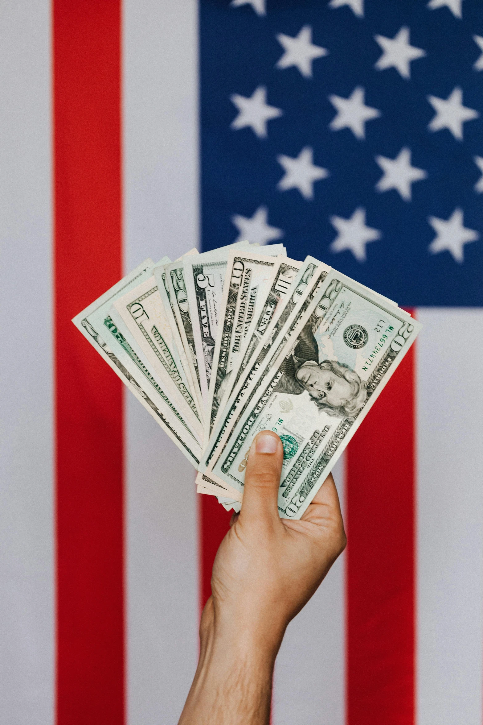 a person holding money in front of an american flag, pexels contest winner, renaissance, instagram post, multiple stories, politicians, 15081959 21121991 01012000 4k