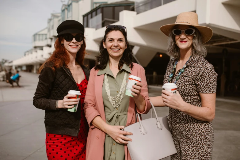 a group of three women standing next to each other, by Lee Loughridge, pexels contest winner, milk and mocha style, in town, manuka, julie heffernan