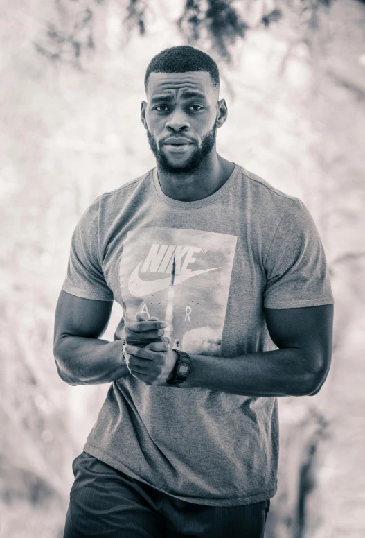 a black and white photo of a man in a t - shirt, inspired by Terrell James, pexels contest winner, wearing fitness gear, color corrected, jaylen brown, square