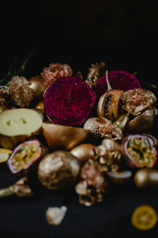 a pile of fruit sitting on top of a table, by Jessie Algie, trending on unsplash, vanitas, wearing gilded ribes, mangosteen, dark and intricate, mushrooms and plants