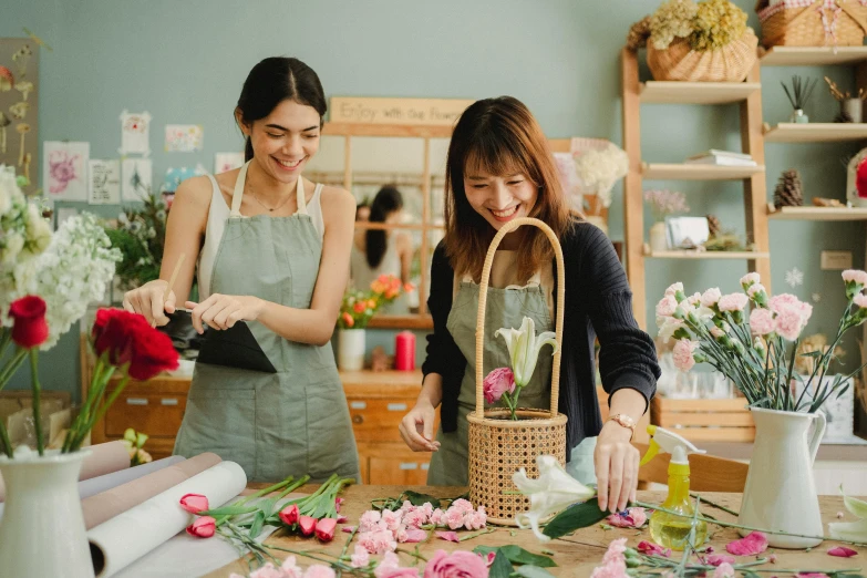 two women are working in a flower shop, pexels contest winner, arts and crafts movement, brittney lee, slightly minimal, joy ang, roses and tulips