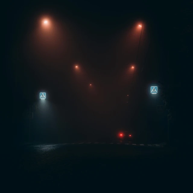 a couple of street lights sitting on the side of a road, by Filip Hodas, symmetric lights and fog, dark hazy room, magicavoxel cinematic lighting, police lights