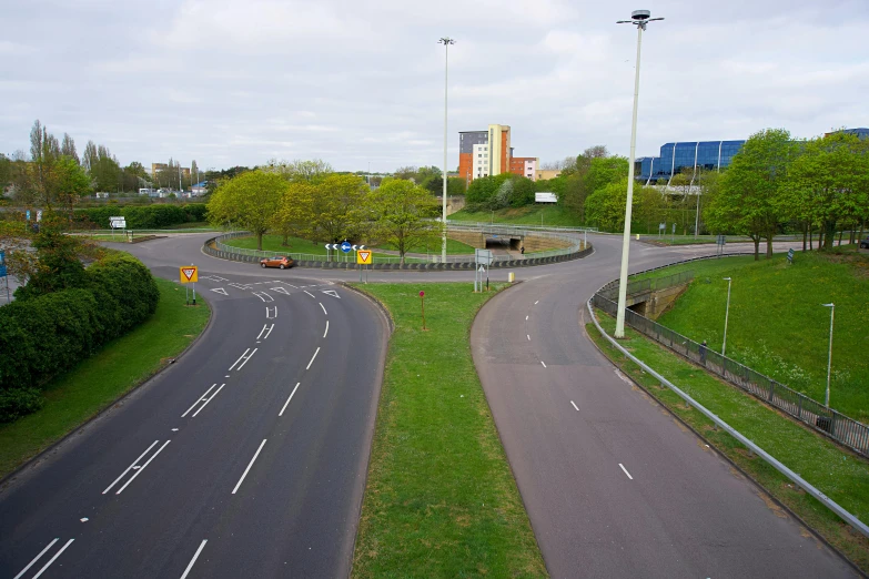 a couple of roads that are next to each other, unsplash, realism, coventry city centre, serpentine curve!!!, hyperrealism photo, round format