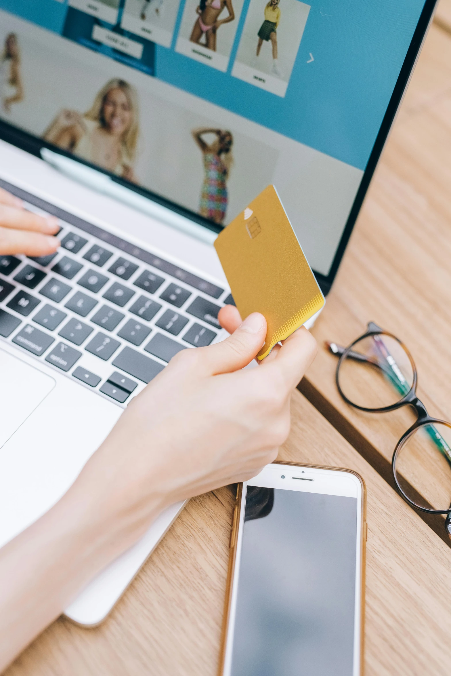 a woman holding a credit card in front of a laptop, a digital rendering, trending on pexels, square, ilustration, gold, photo for a store