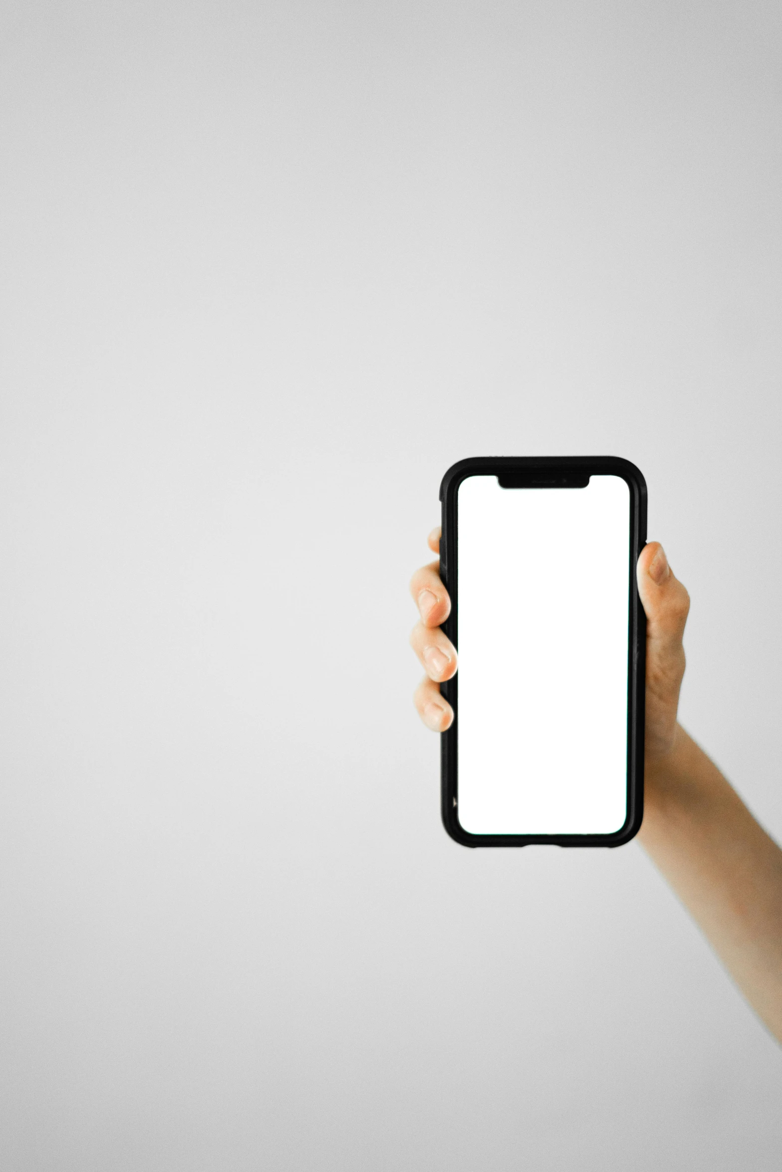 a person holding up a smart phone with a white screen, by Robbie Trevino, trending on pexels, minimalism, square, case, screensaver, white bg