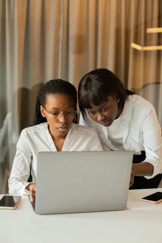 a couple of people that are looking at a laptop, woman holding another woman, rosen zulu, thumbnail, teaching