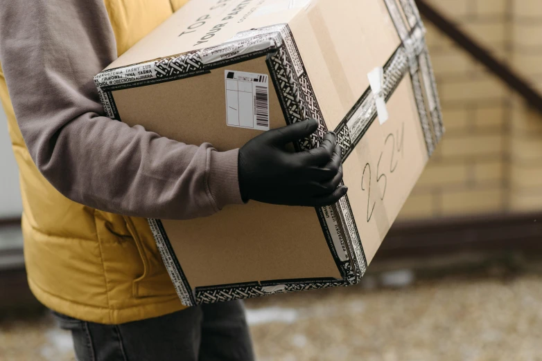 a close up of a person holding a box, fully functional, brown, exterior shot, thumbnail