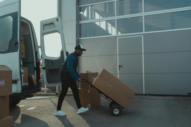 a man pushing a cart full of boxes, pexels contest winner, hurufiyya, avatar image, truck, cinematic footage, full body angle