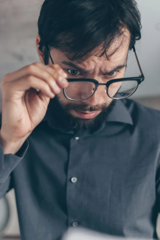 a man with glasses looking at a laptop, pexels, hyperrealism, square masculine facial features, disappointed, dynamic closeup, inspect in inventory image