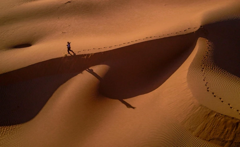 a person standing in the middle of a desert, inspired by Steve McCurry, pexels contest winner, drop shadow, australian tonalism escher, running freely, intricate detailed 8 k