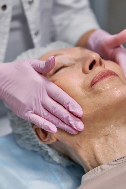 a close up of a person getting a facial massage, profile image, an old lady with red skin, square jaw-line, made of lab tissue