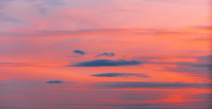 a plane that is flying in the sky, inspired by Frederic Church, pexels contest winner, romanticism, pink sunset hue, dayglo pink blue, overcast dusk, crimson gradient