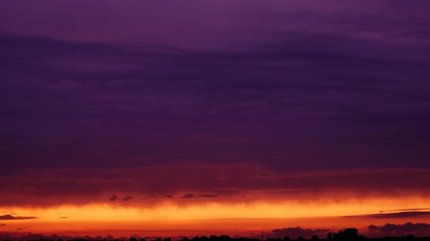 the sky is purple and orange as the sun sets, pexels contest winner, romanticism, overcast sky, sky line, low purple flame, multicoloured