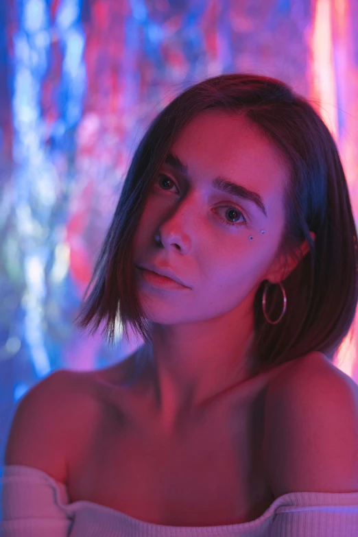 a woman in a white top posing for a picture, an album cover, inspired by Elsa Bleda, trending on pexels, red and blue neon, lily collins, iridescent skin, androgynous male