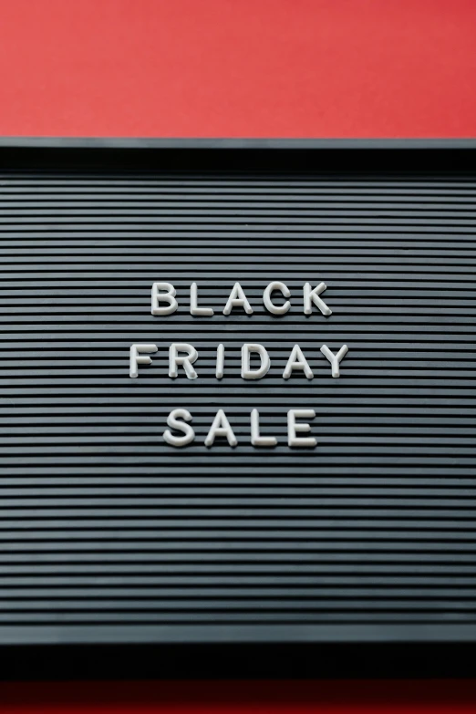 a black friday sale sign on a red background, a photo, by Harvey Quaytman, graffiti, 256x256, black steel buildings, shop front, slate