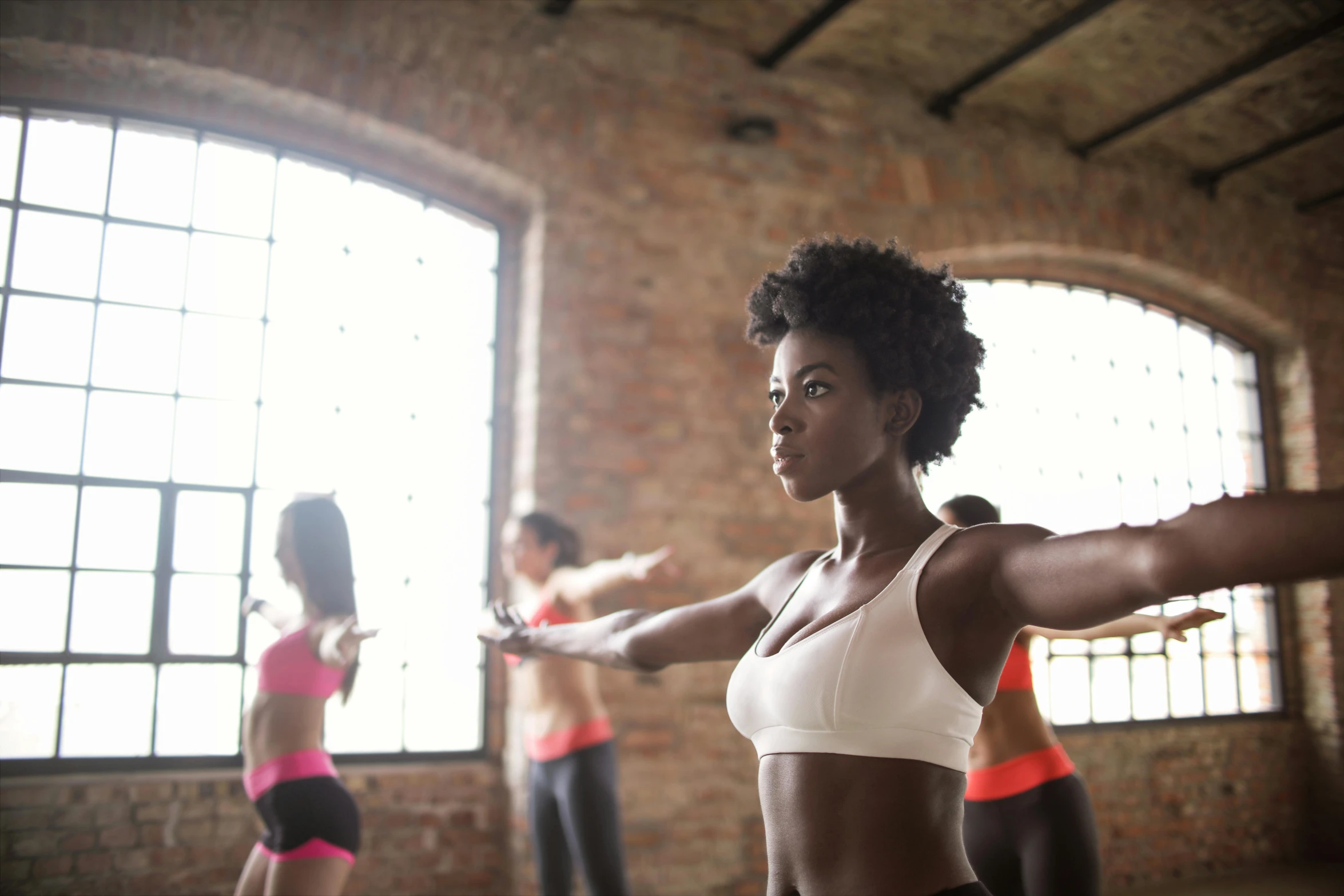 a group of women doing zumba zumba zumba zumba zumba zumba zumba zumba zumba zumba zumba zu, by Arabella Rankin, trending on pexels, figuration libre, photo of a black woman, contemplating, arms stretched out, training bra