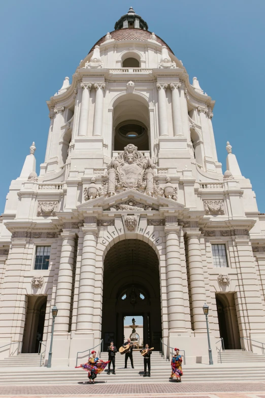 a group of people that are standing in front of a building, inspired by Christopher Wren, unsplash, neoclassicism, central california, neoclassical tower with dome, tall entry, exterior view