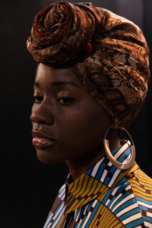 a close up of a person wearing a turban, inspired by Makoto Aida, afrofuturism, gold hoop earings, maria borges, dark natural glow, patterned clothing