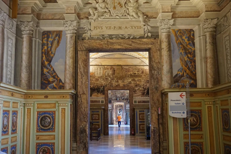 a picture of the inside of a building, by Cagnaccio di San Pietro, pexels contest winner, neoclassicism, massive decorated doors, promo image, walking to the right, 2 5 6 x 2 5 6 pixels