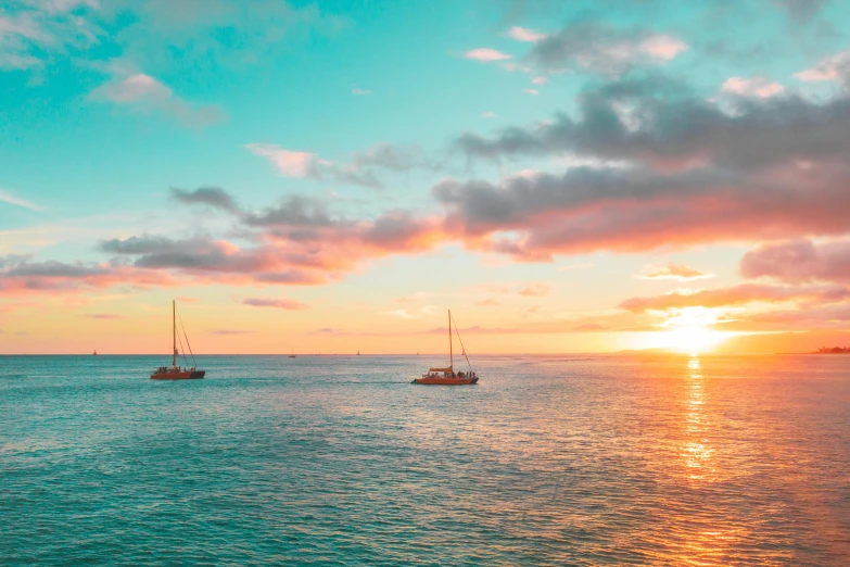 a group of boats floating on top of a body of water, by Daniel Lieske, pexels contest winner, waikiki beach, sunset colors, turquoise horizon, three masts