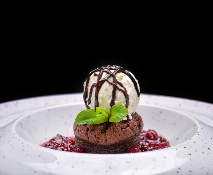 a dessert sitting on top of a white plate, by Aleksander Gierymski, pixabay contest winner, 💋 💄 👠 👗, mint, black forest, molten