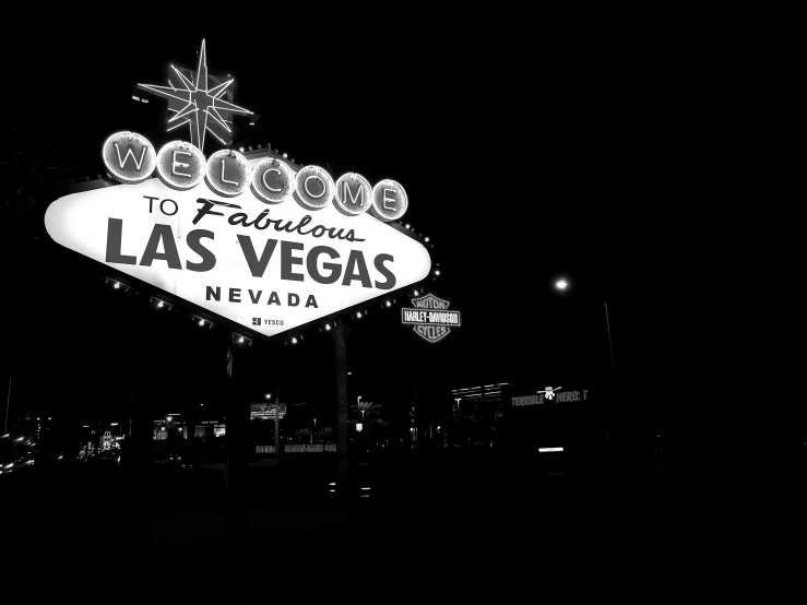 a black and white photo of the welcome to fabulous las sign, a black and white photo, pexels, night photo, fallout new vegas, beautiful view, 8 0. lv