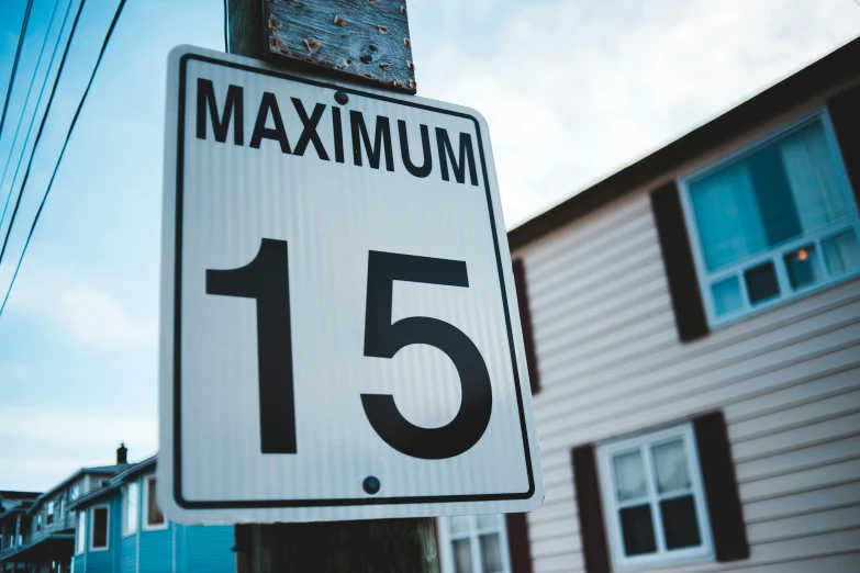 a close up of a street sign on a pole, pexels contest winner, maximalism, 1 5 9 5, countdown, mass housing, 1 6 years old