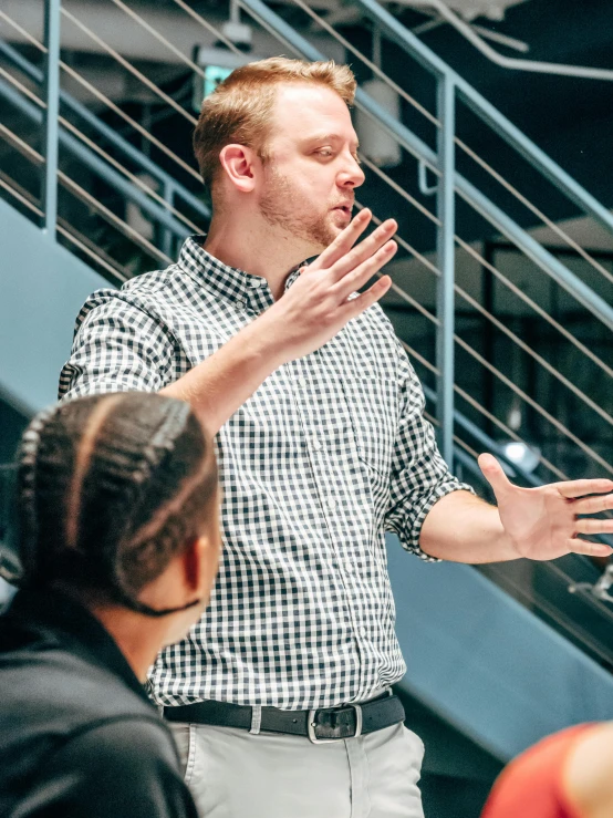 a man giving a presentation to a group of people, by Jason Felix, unsplash, instagram story, conductor, jordan grimmer and james jean, pondering