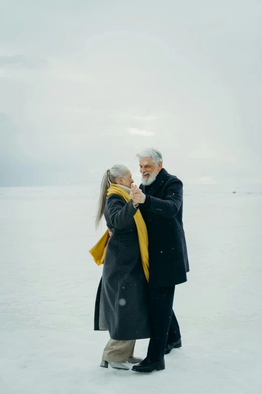 a man and a woman standing in the snow, an album cover, by Jaakko Mattila, pexels contest winner, gray haired, dance, 15081959 21121991 01012000 4k, lake