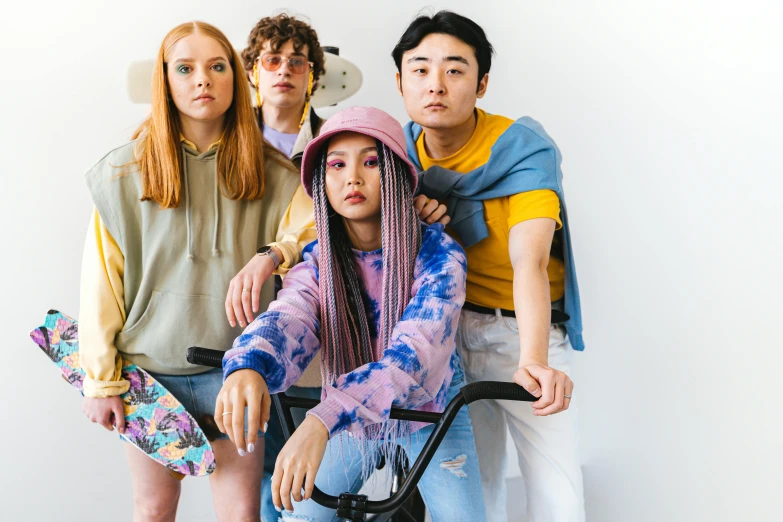 a group of young people standing next to each other, a portrait, trending on pexels, renaissance, colorful clothing, acid wash layering, young asian girl, sadie sink