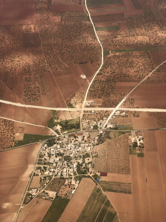 an aerial view of a town in the middle of a desert, by Israel Tsvaygenbaum, dau-al-set, seville, connecting lines, close - up photograph, high quality image”