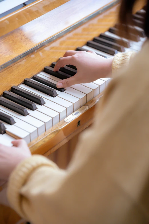 a close up of a person playing a piano