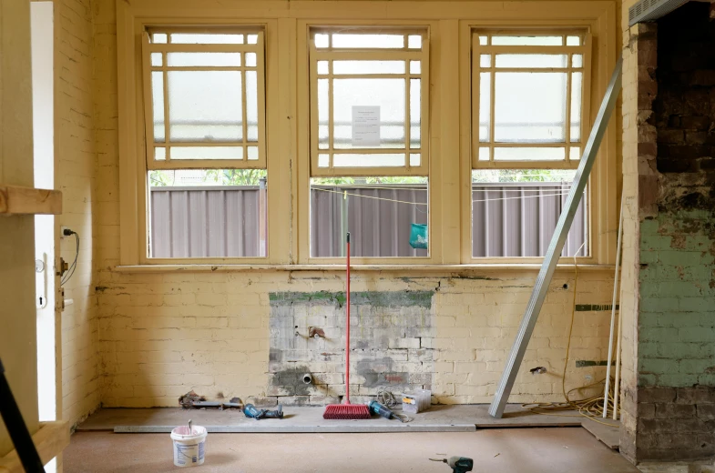 a room that has some construction equipment in it, unsplash, arts and crafts movement, windowsill, mid-transformation, background image, australian