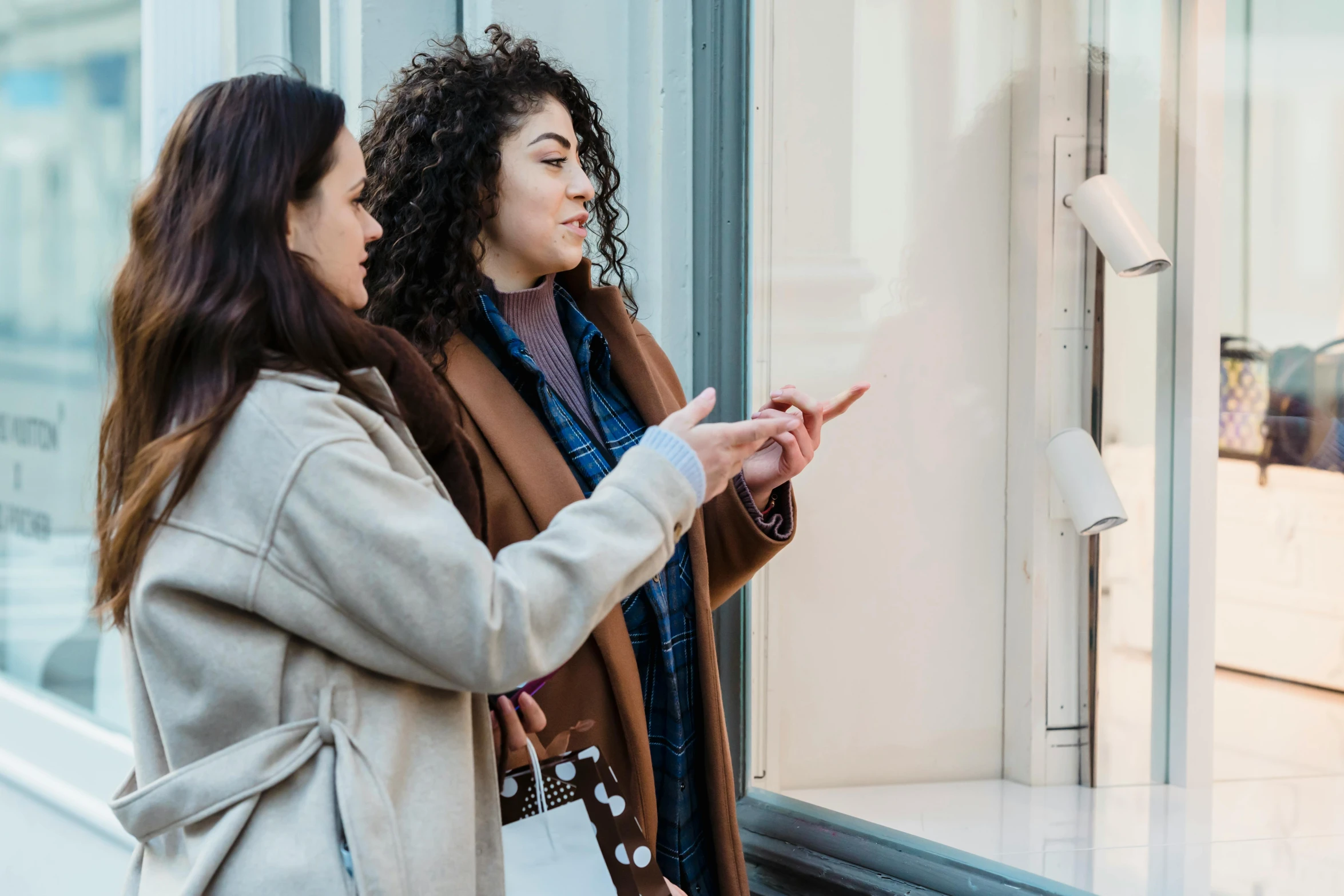 a couple of women standing in front of a window, people shopping, pointing, trending on artsation, multiple stories