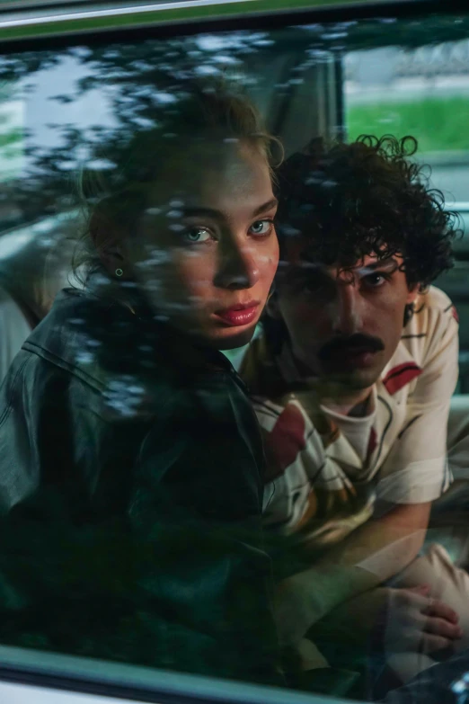 a man and a woman sitting in a car, inspired by Nan Goldin, renaissance, zoomed in, finn wolfhard, safari, high-res