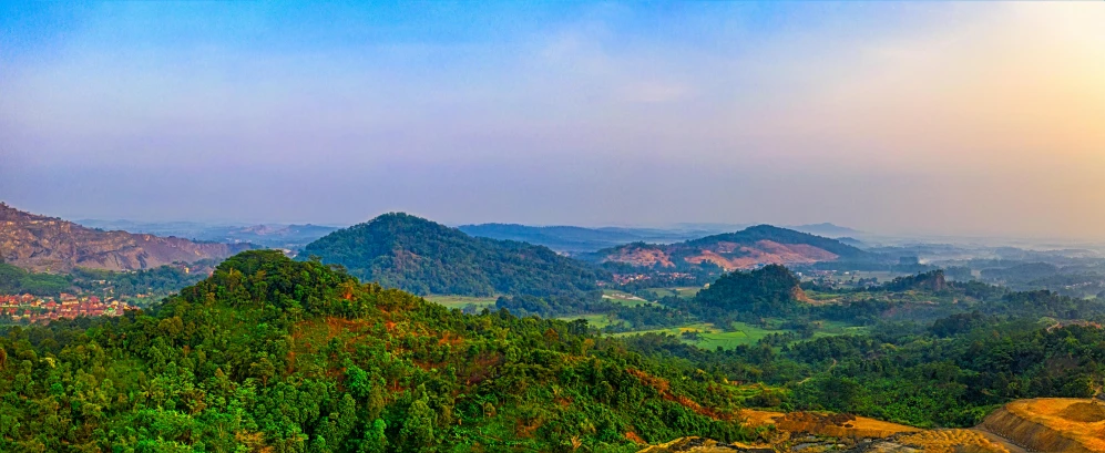 a view of the mountains from the top of a hill, an album cover, pexels contest winner, sumatraism, epic khajuraho, panoramic widescreen view, fan favorite, kerala village