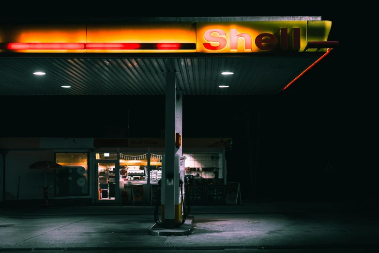 a gas station at night with a neon sign, an album cover, pexels contest winner, shell, magazine photo, hd wallpaper, 1 5 0 4