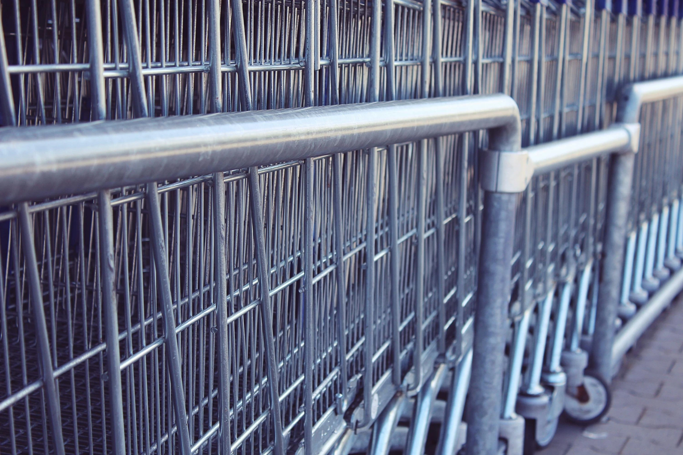 a row of shopping carts sitting next to each other, by Carey Morris, square lines, stockphoto, grayish, giant athanor