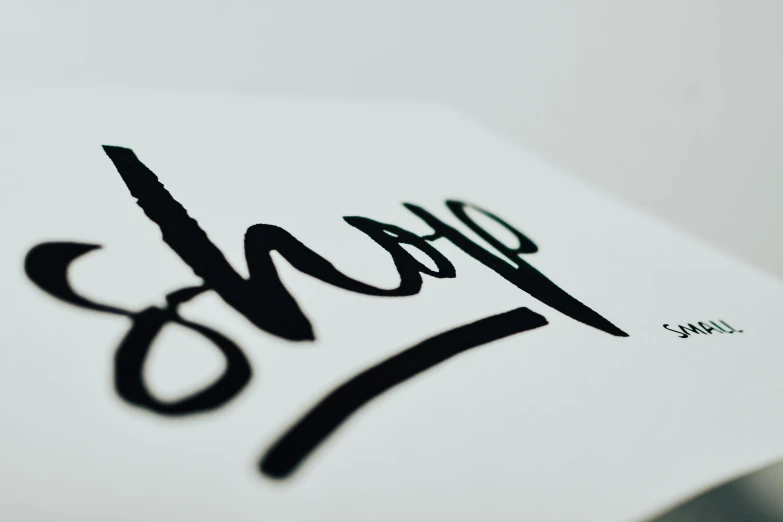 a close up of a piece of paper with the word yes written on it, an ink drawing, by Mór Than, unsplash, graffiti, on white paper, behance lemanoosh, signature, low-angle