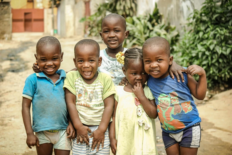 a group of children standing next to each other, by Sam Dillemans, pexels contest winner, smiling at the camera, township, 5 years old, thumbnail