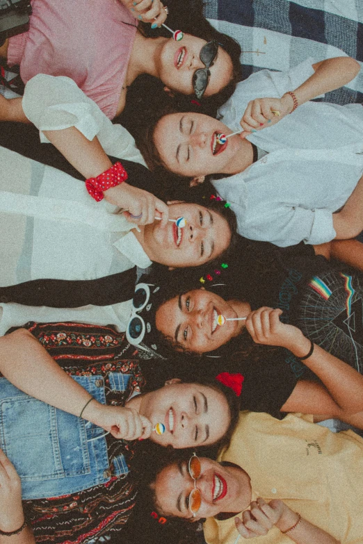 a group of young women standing next to each other, a picture, pexels contest winner, happening, many teeth, they are all laying down, cindy avelino, childhood friend vibes