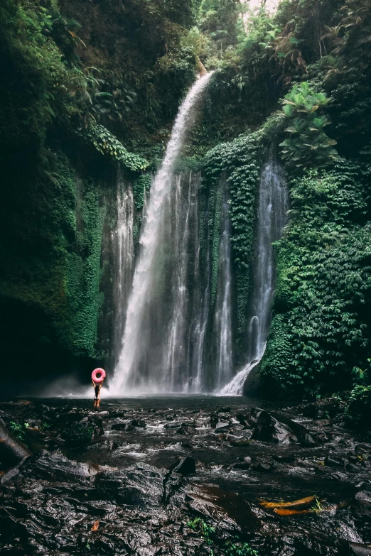 a person standing in front of a waterfall, pexels contest winner, sumatraism, lush surroundings, best color graded, fine art print, blank